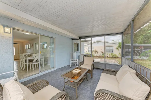 an aerial view of a house with a yard and lake view