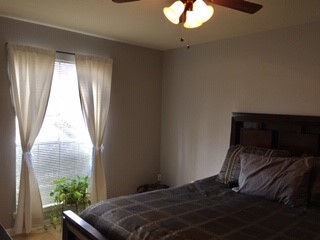 8787 Brae Acres Road, Unit 403 Houston, TX 77074 - Photo 6 of 7 a bedroom with a bed and a window