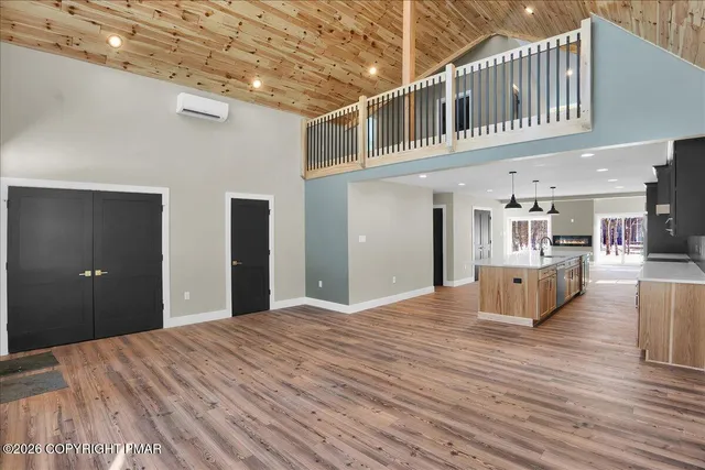 a kitchen with stainless steel appliances a refrigerator sink and microwave