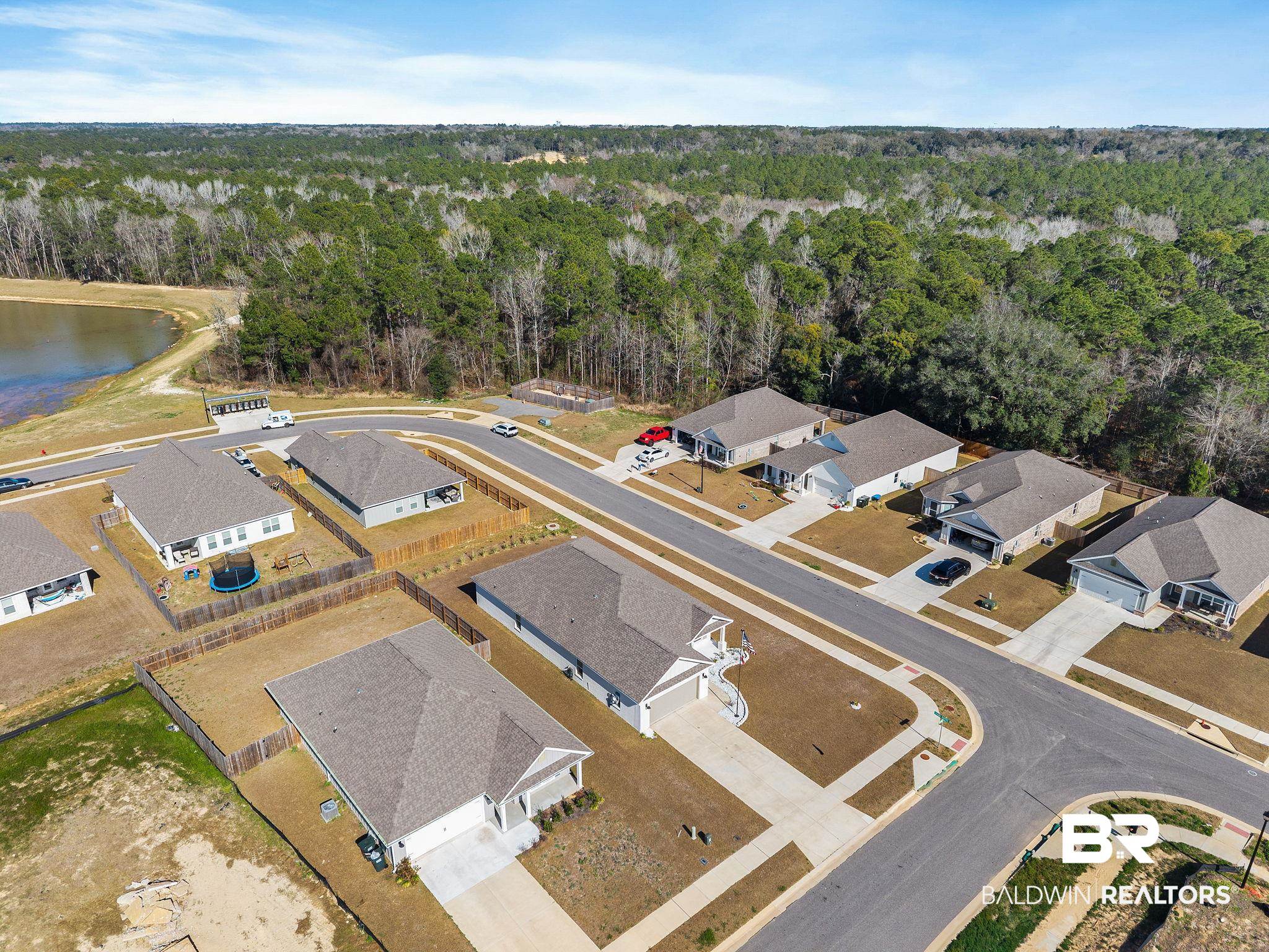 12919 Torrent Road Fairhope, AL 36532 - Photo 65 of 74 Aerial view of residential area with a large body of water