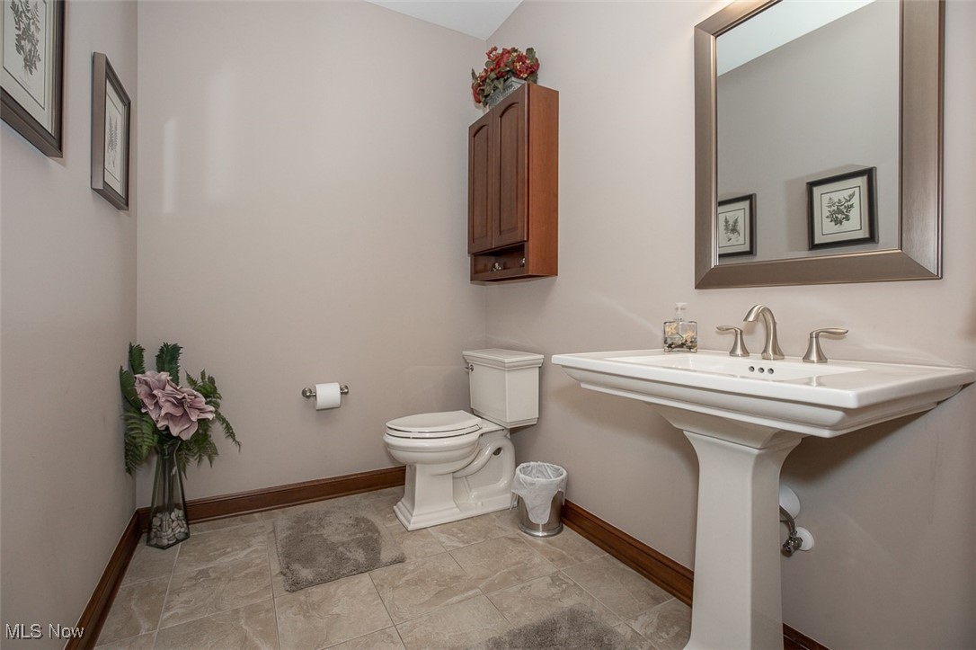 9155 Shank Road Litchfield, OH 44253 - Photo 28 of 47 Bathroom with baseboards and light tile patterned floors