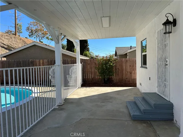 a view of a house with backyard and porch