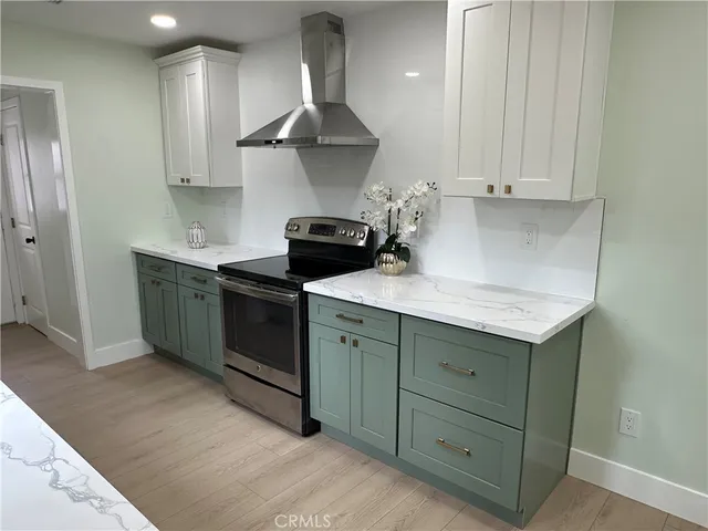 a kitchen with a stove and a sink