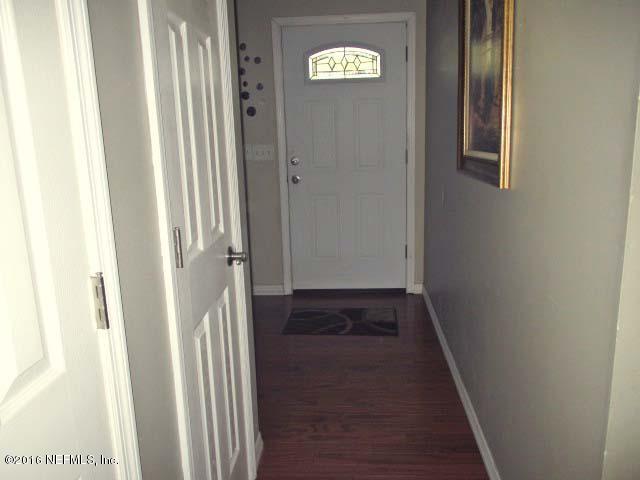 96726 Blackrock Road Yulee, FL 32097 - Photo 12 of 27 a view of a hallway with wooden floor