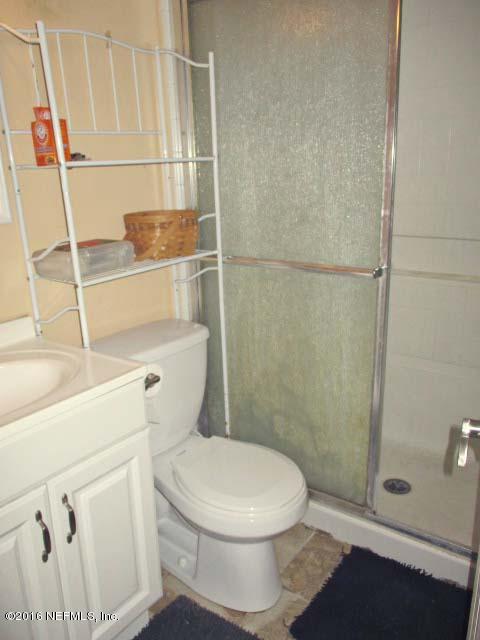 96726 Blackrock Road Yulee, FL 32097 - Photo 13 of 27 a white toilet sitting next to a bathroom sink