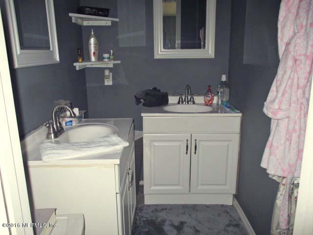 96726 Blackrock Road Yulee, FL 32097 - Photo 16 of 27 a utility room with sink dryer and washer