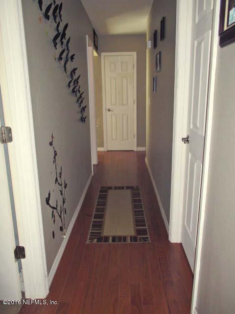 96726 Blackrock Road Yulee, FL 32097 - Photo 20 of 27 wooden floor in an empty room with a window