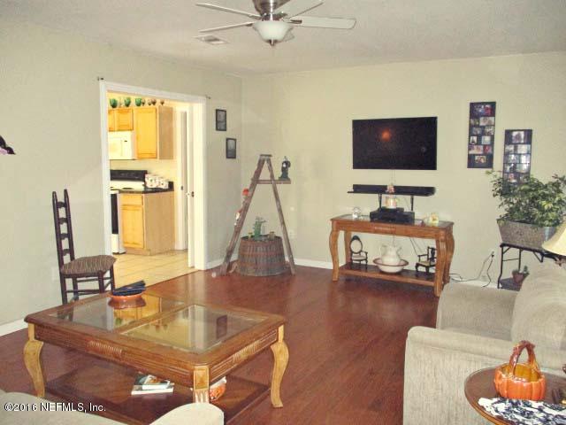96726 Blackrock Road Yulee, FL 32097 - Photo 2 of 27 a living room with furniture and a flat screen tv