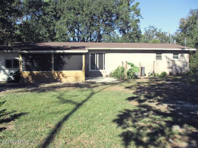 96726 Blackrock Road Yulee, FL 32097 - Photo 23 of 27 a view of a back yard of the house