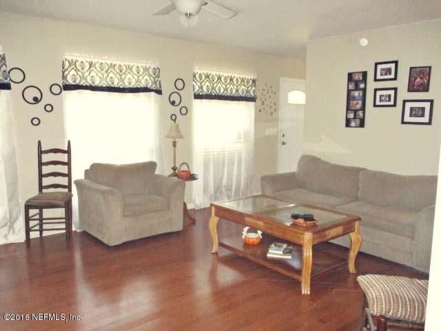 96726 Blackrock Road Yulee, FL 32097 - Photo 5 of 27 a living room with furniture and a table