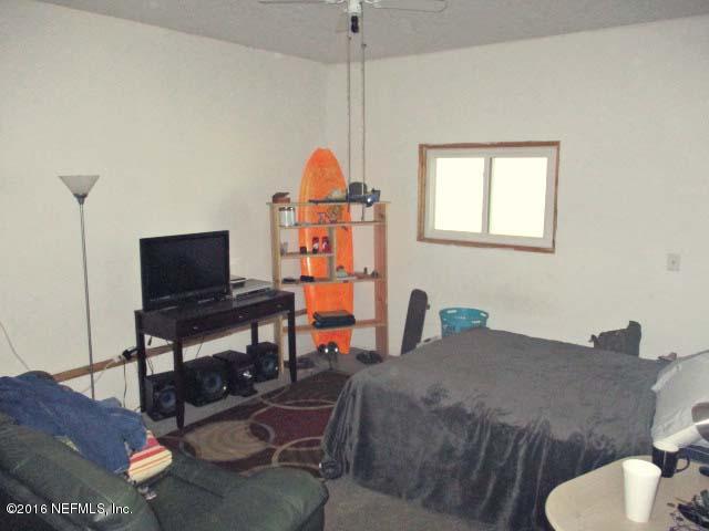 96726 Blackrock Road Yulee, FL 32097 - Photo 7 of 27 a view of a workspace with furniture and a window
