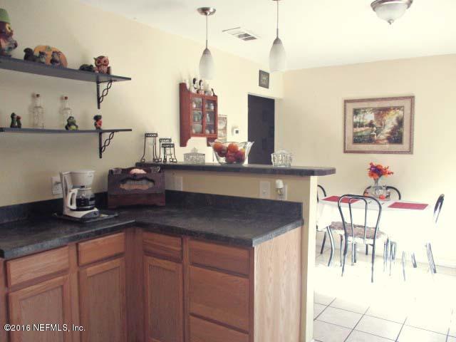 96726 Blackrock Road Yulee, FL 32097 - Photo 8 of 27 a kitchen with sink and cabinets