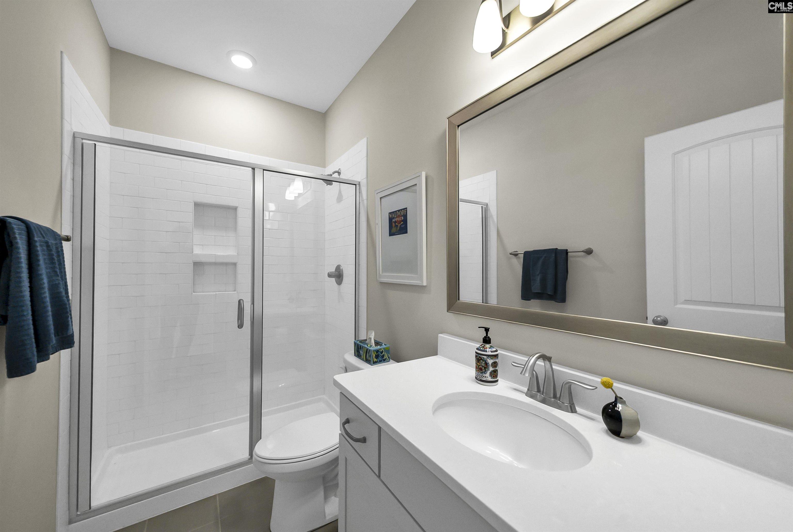 515 Malachite Lane Chapin, SC 29036 - Photo 49 of 63 a bathroom with a sink toilet and shower