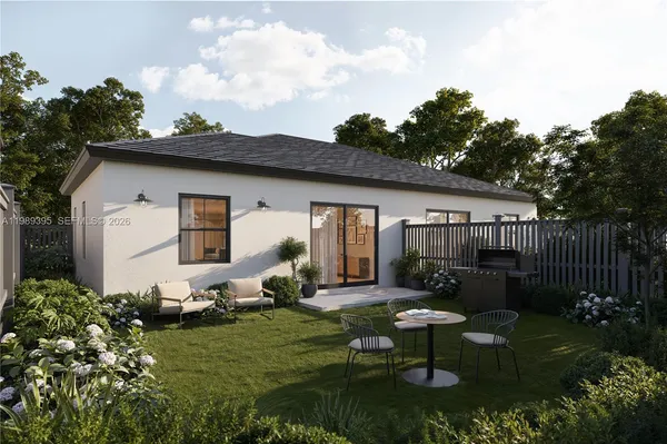 a front view of house with a garden and patio