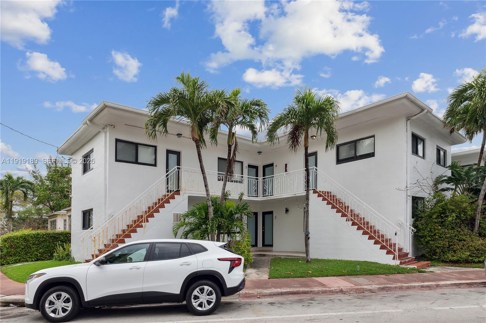 8010 Crespi Boulevard, Unit 4 Miami Beach, FL 33141 - Photo 14 of 16 a front view of a house with garden