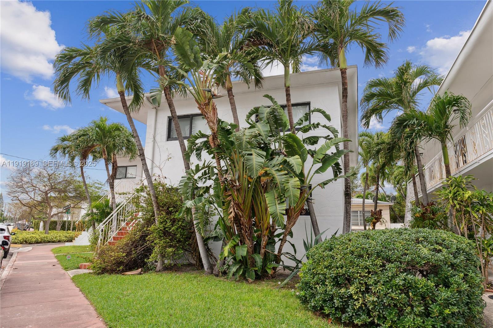 8010 Crespi Boulevard, Unit 4 Miami Beach, FL 33141 - Photo 16 of 16 a view of a backyard with palm trees