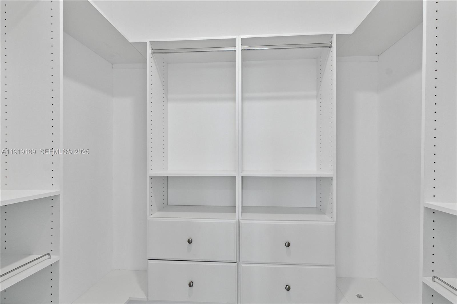8010 Crespi Boulevard, Unit 4 Miami Beach, FL 33141 - Photo 7 of 16 a view of an empty walk in closet