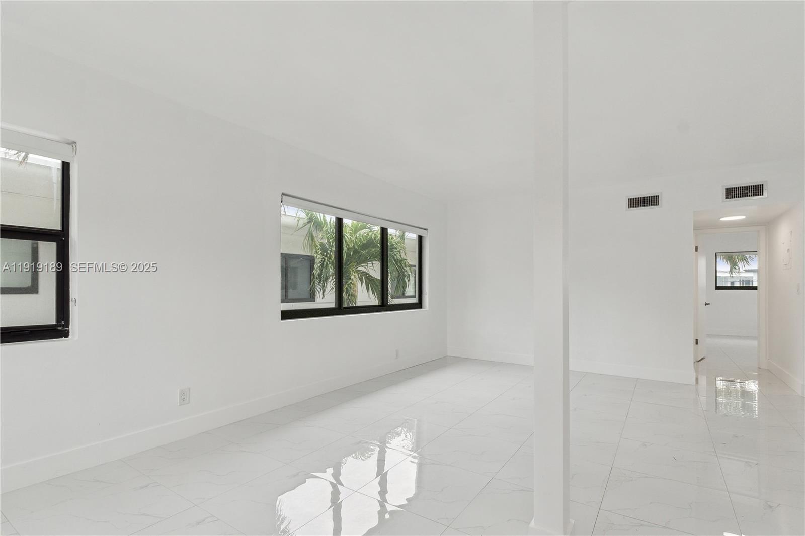 8010 Crespi Boulevard, Unit 4 Miami Beach, FL 33141 - Photo 8 of 16 a view of an empty room