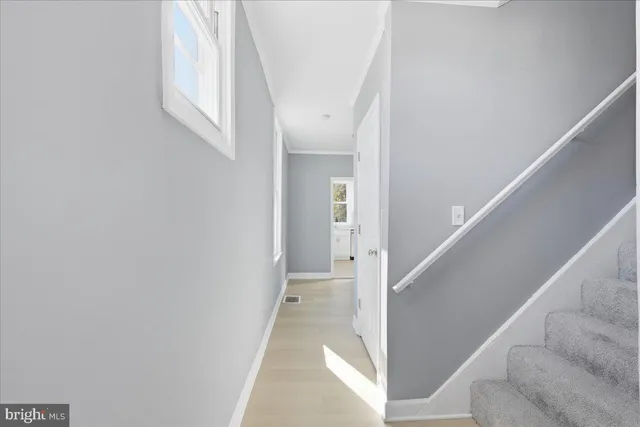 a view of a hallway with staircase