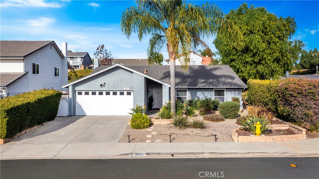 front view of house with potted plants