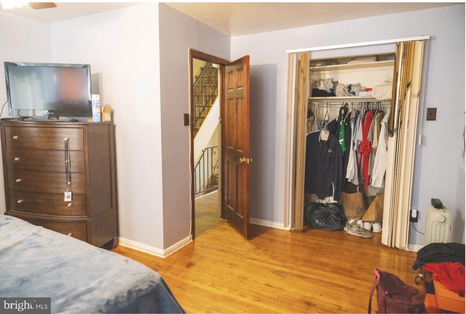 6021 Chestnut Street Philadelphia, PA 19139 - Photo 13 of 21 a bedroom with a bed and a mirror
