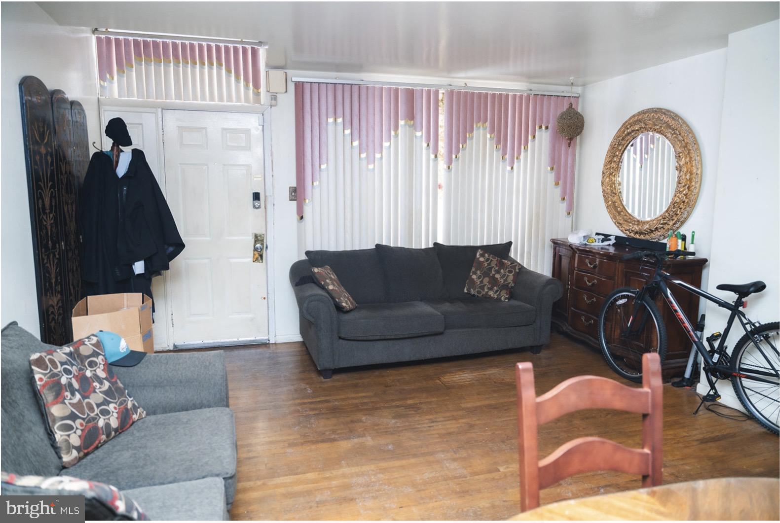 6021 Chestnut Street Philadelphia, PA 19139 - Photo 2 of 21 a living room with furniture and a wooden floor