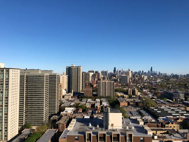 a view of a city with tall buildings
