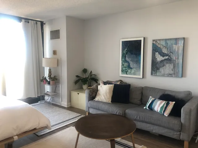 a living room with furniture and a window