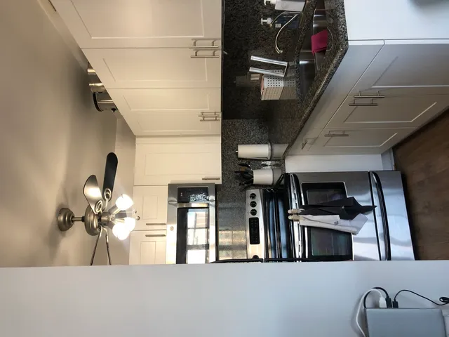 a view of a living room with furniture