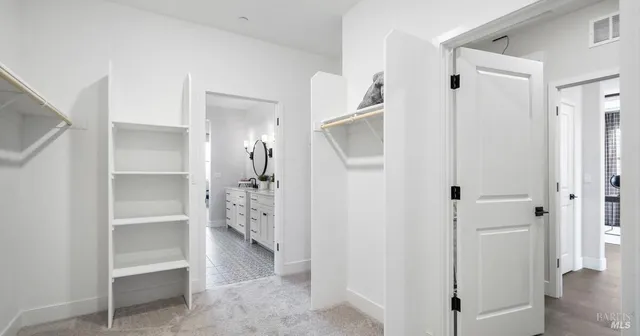 a view of a hallway with closet