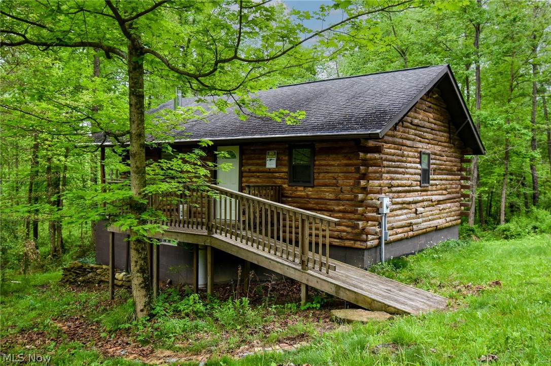 60404 Pigeon Point Road Barnesville, OH 43713 - Photo 1 of 18 View of home's exterior featuring a deck