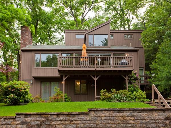 446 South Border Road Winchester, MA 01890 - Photo 1 of 18 a front view of a house with garden