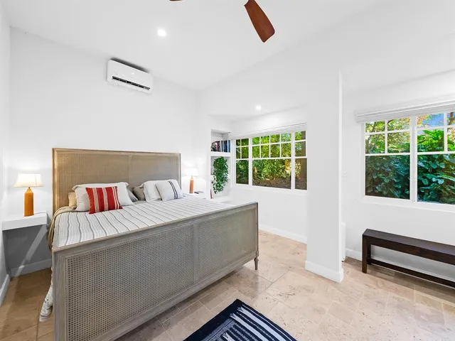 a room with a bed and a window