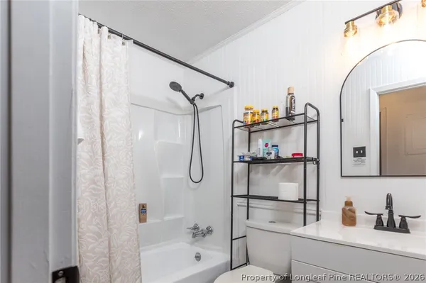 a bathroom with a tub and a shower