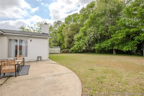 a backyard of a house with lots of green space