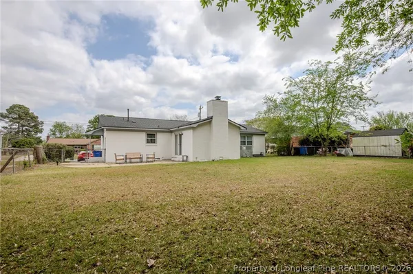 a view of a house with a yard and garage