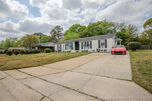 a view of houses with yard