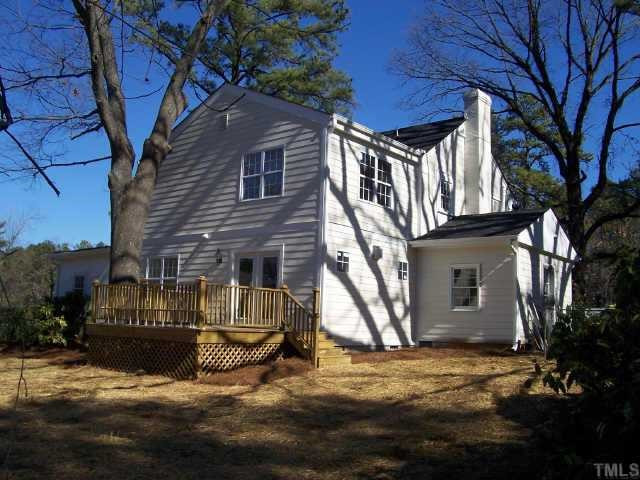 813 Chamberlain Street Raleigh, NC 27607 - Photo 2 of 9 Rear elevation shows french doors to a new deck, and large landscaped yard. Other
