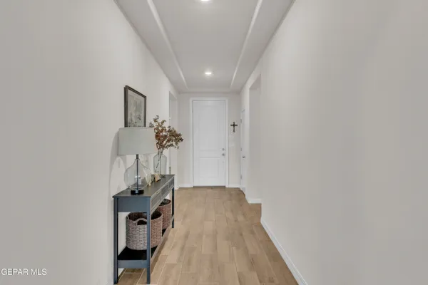 a view of a small space with wooden floor and a bathroom
