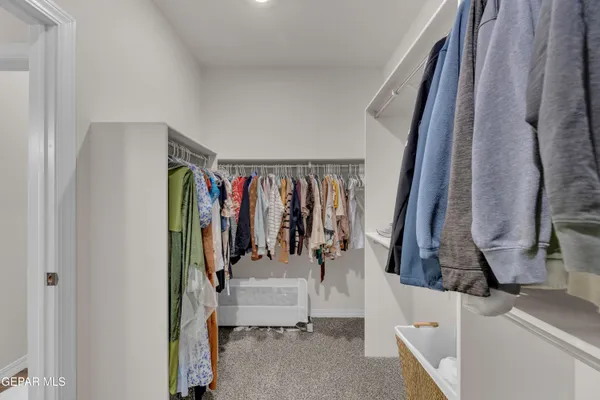 a bathroom with a granite countertop sink a toilet and a mirror