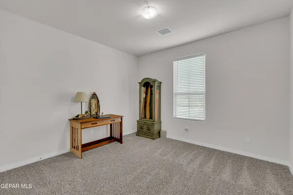a kitchen with granite countertop stainless steel appliances a sink stove and refrigerator