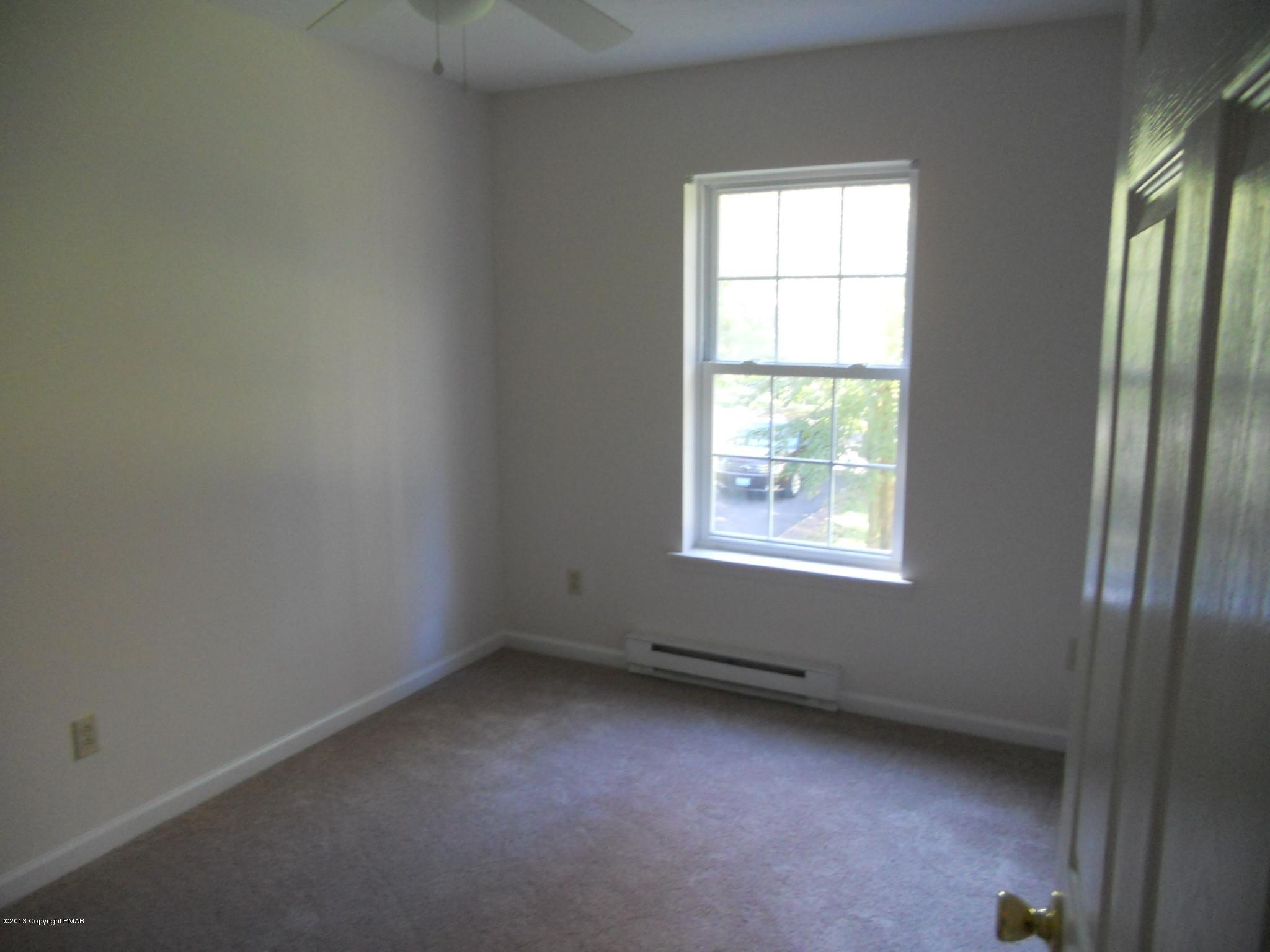 1123 Rhododendron Lane Pocono Summit, PA 18346 - Photo 6 of 10 an empty room with a window