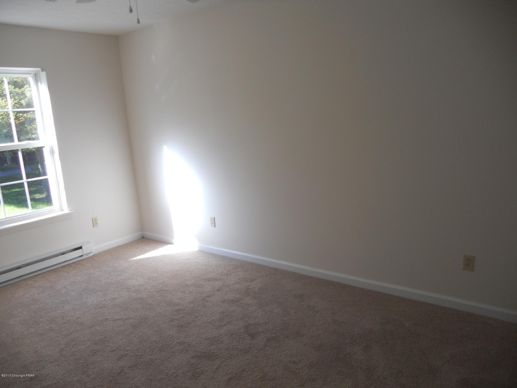 1123 Rhododendron Lane Pocono Summit, PA 18346 - Photo 7 of 10 an empty room with a window