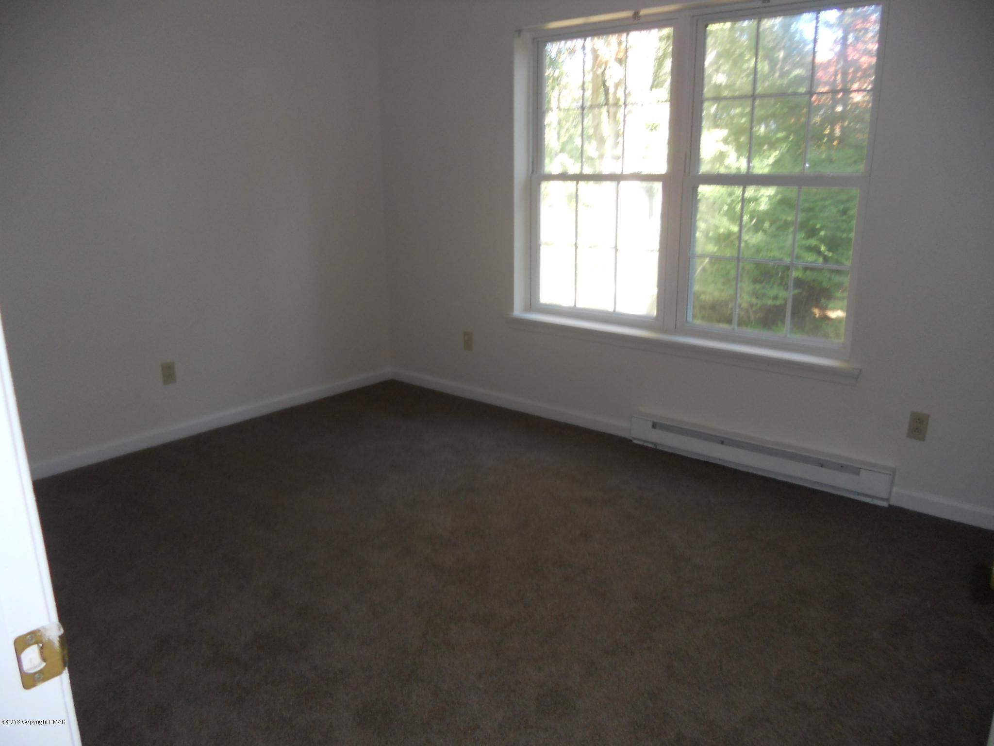 1123 Rhododendron Lane Pocono Summit, PA 18346 - Photo 8 of 10 an empty room with a window