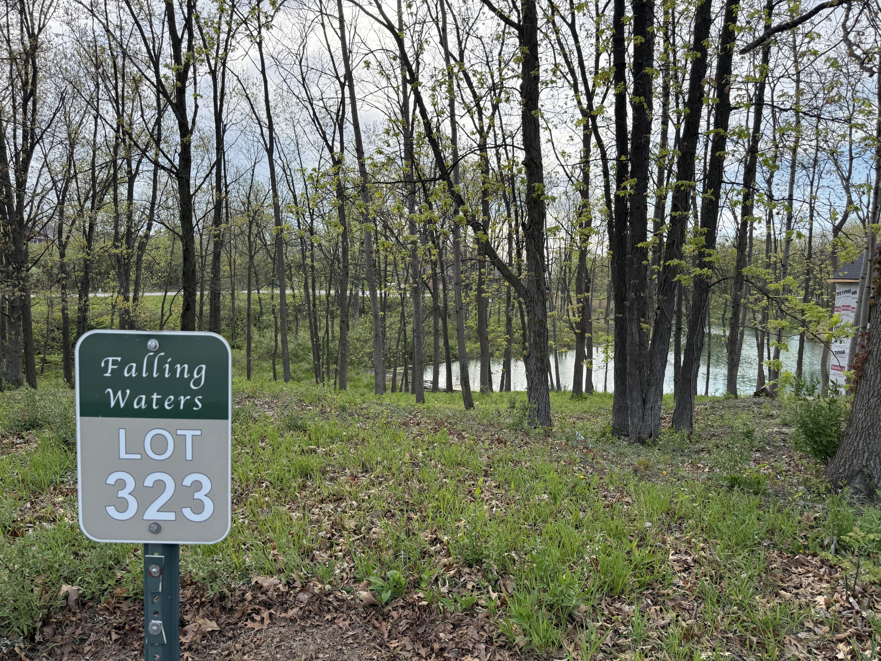 764 Ketill Trace Crown Point, IN 46307 - Photo 2 of 5 a sign that is sitting on a wooden fence