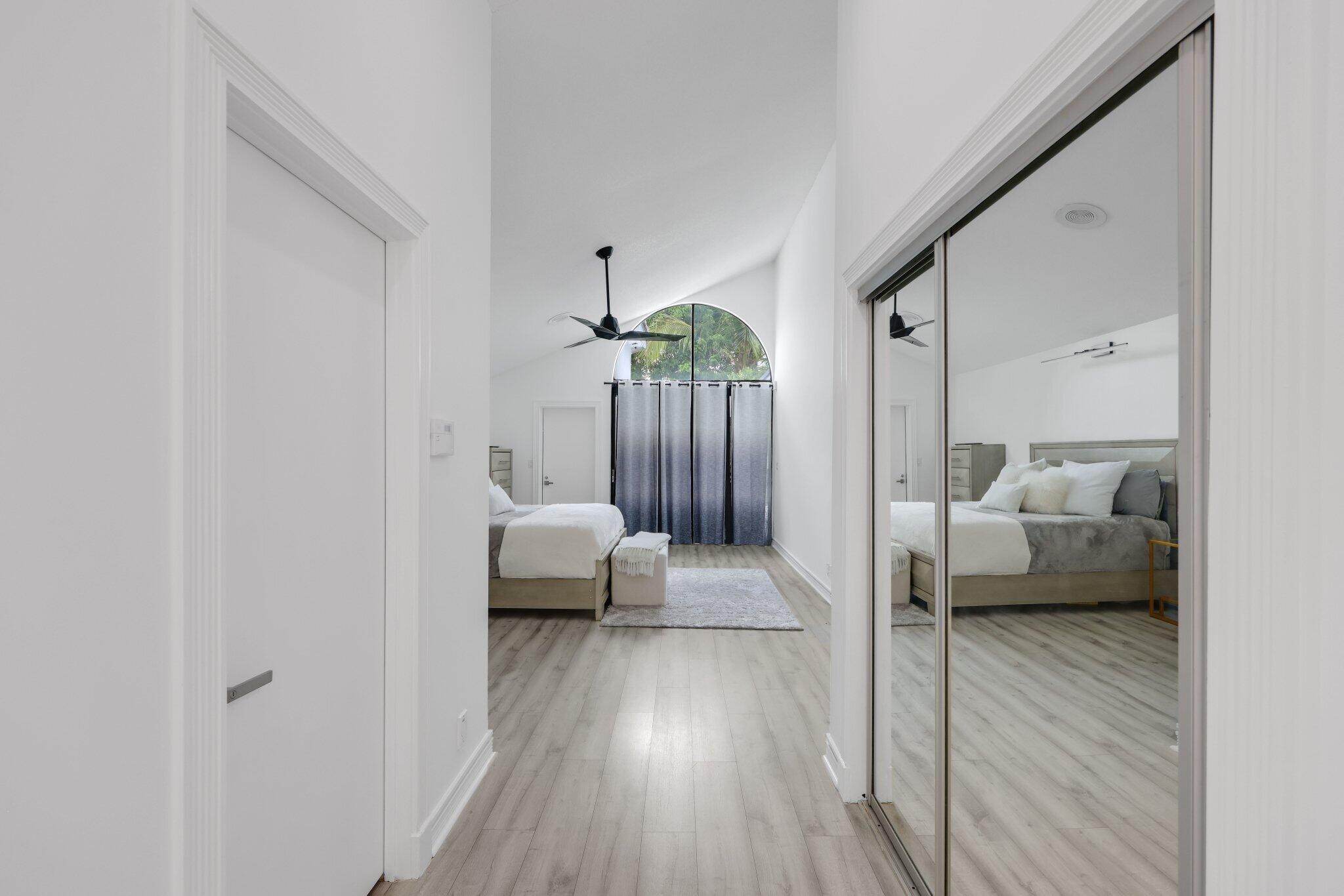 10106 Spyglass Way Boca Raton, FL 33498 - Photo 19 of 44 a living room with furniture and a wooden floor