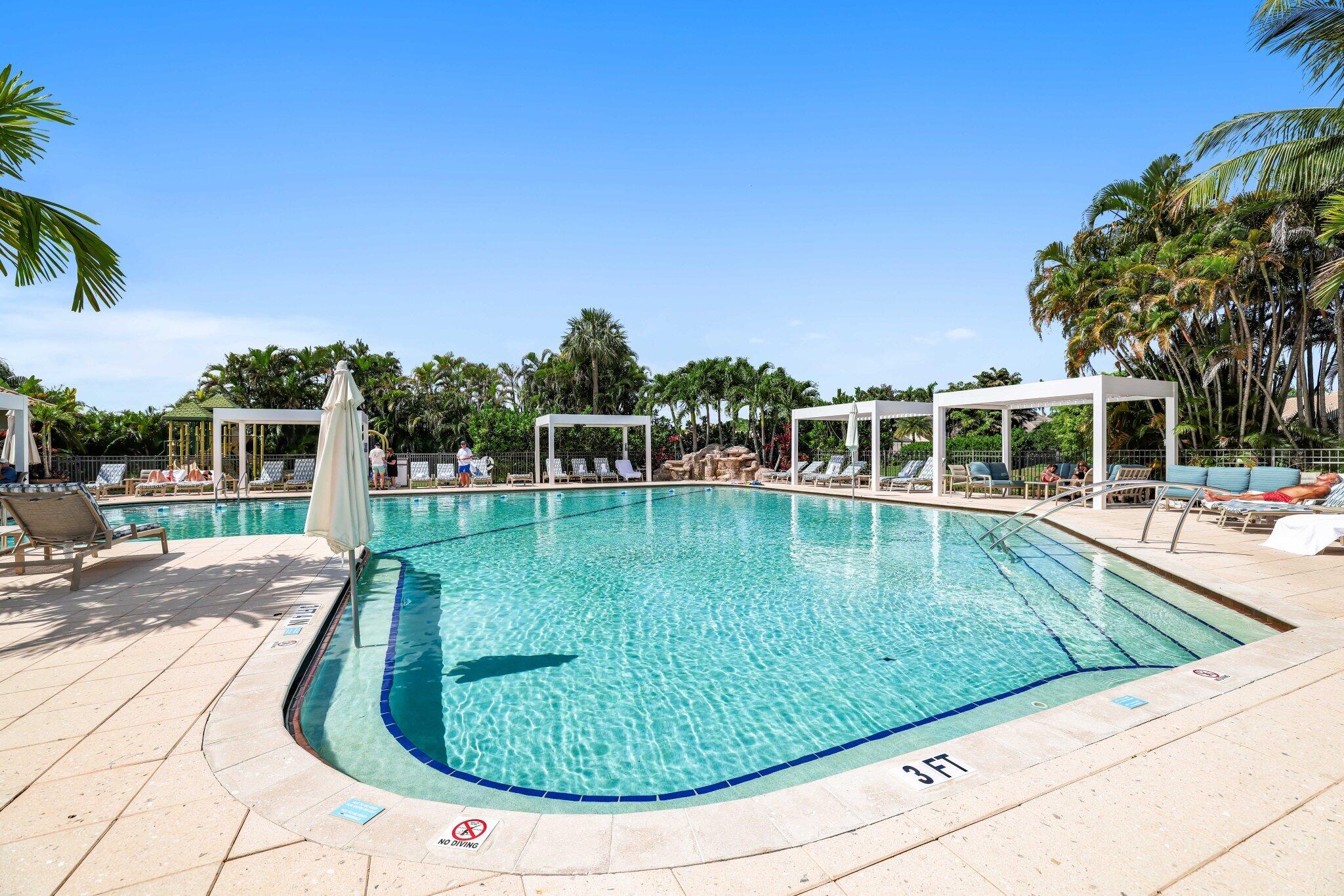 10106 Spyglass Way Boca Raton, FL 33498 - Photo 37 of 44 a view of a swimming pool with a yard
