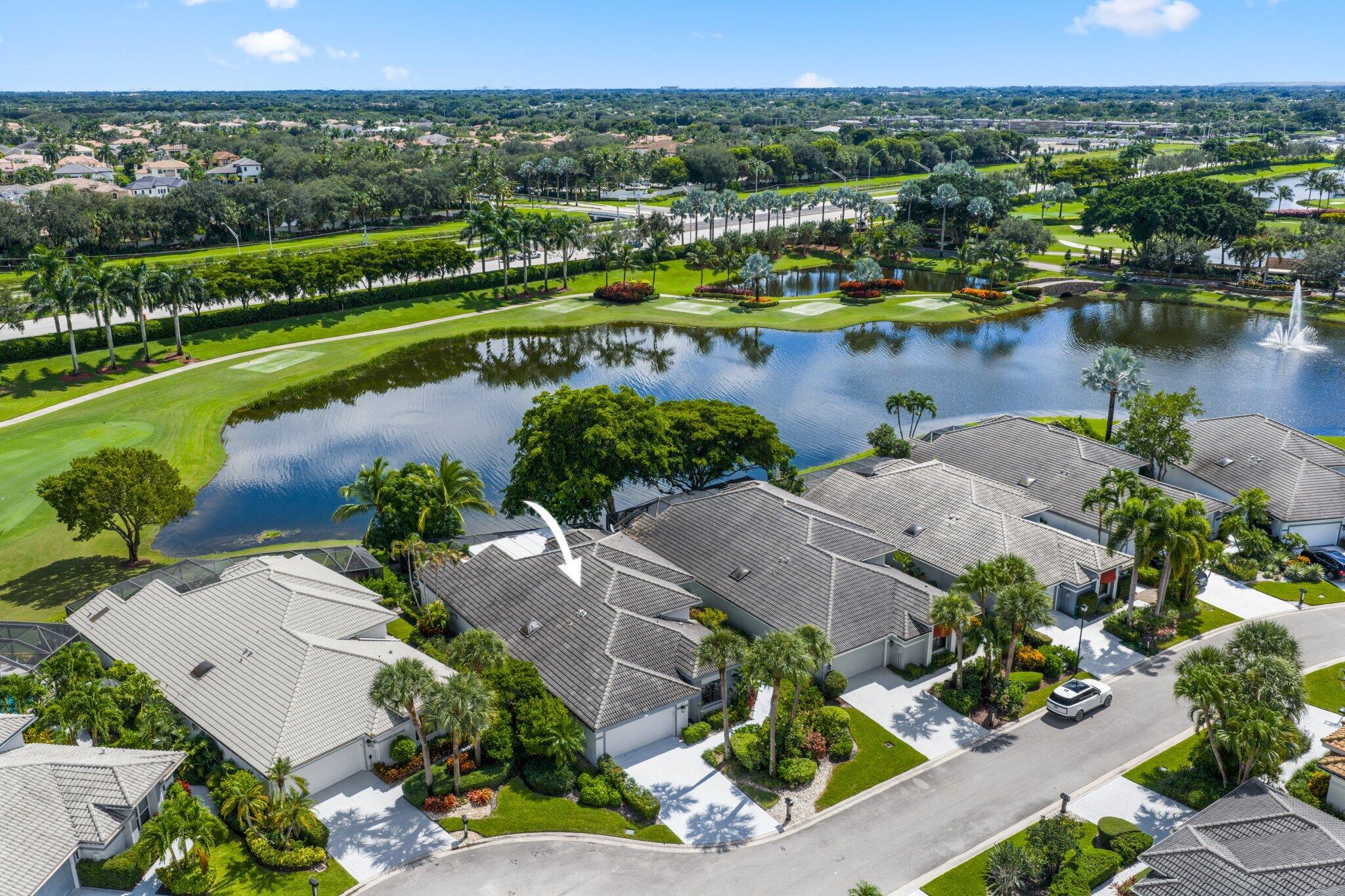 10106 Spyglass Way Boca Raton, FL 33498 - Photo 42 of 44 an aerial view of a house with a lake view