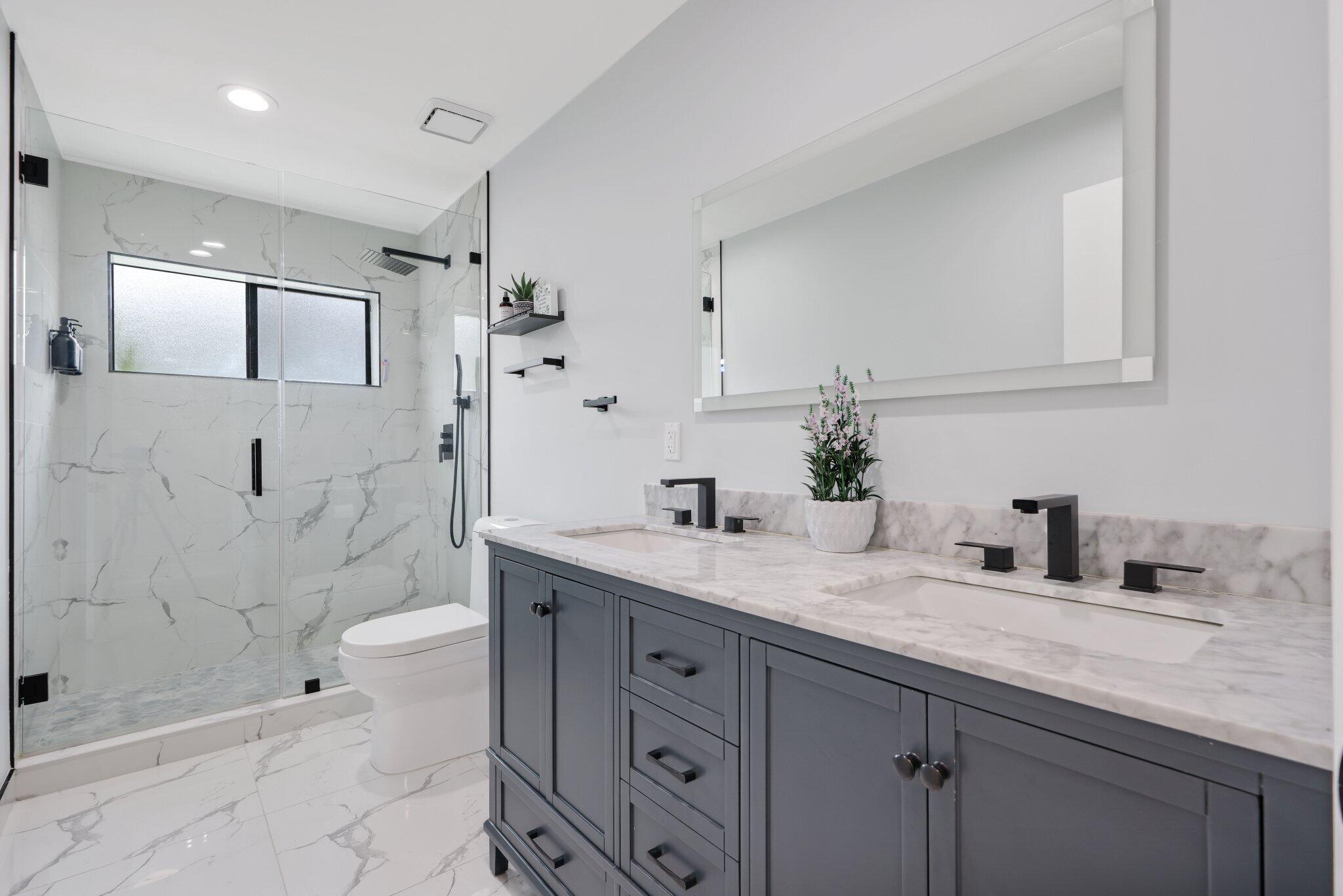 10106 Spyglass Way Boca Raton, FL 33498 - Photo 5 of 44 a bathroom with a granite countertop sink mirror and shower