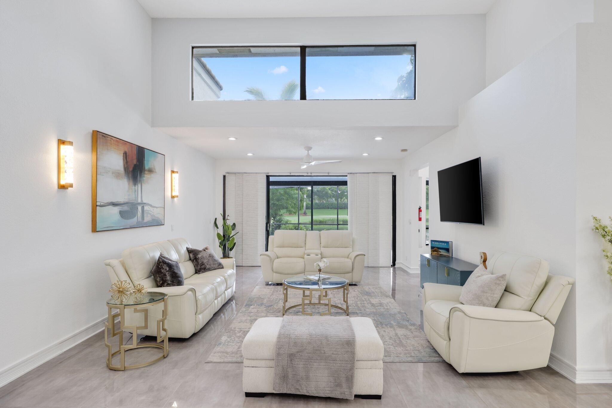 10106 Spyglass Way Boca Raton, FL 33498 - Photo 7 of 44 a living room with furniture and a flat screen tv